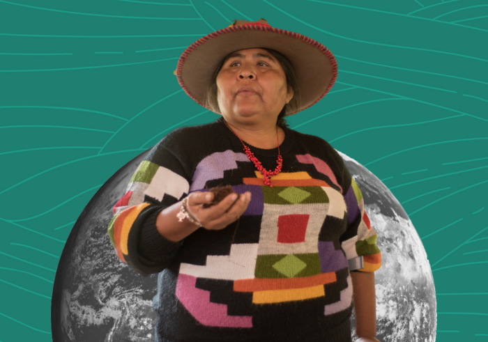 A stylized image of an Indigenous woman against the backdrop of a moon. The woman is wearing a hat and holding soil in the palm of her hands.