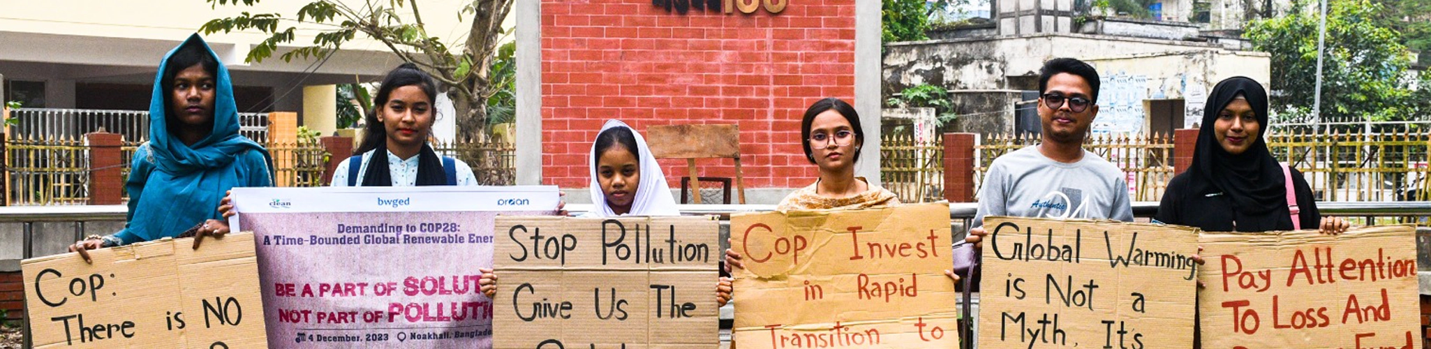 Members of Coastal Livelihood and Environmental Action Network (CLEAN) protesting with banners.